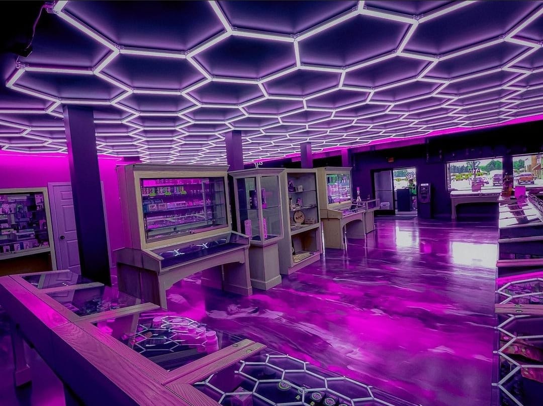 First Place Best Retail: purple metallic epoxy floor under honeycomb LED lights — Jay Patel, JK Precision Cleaning