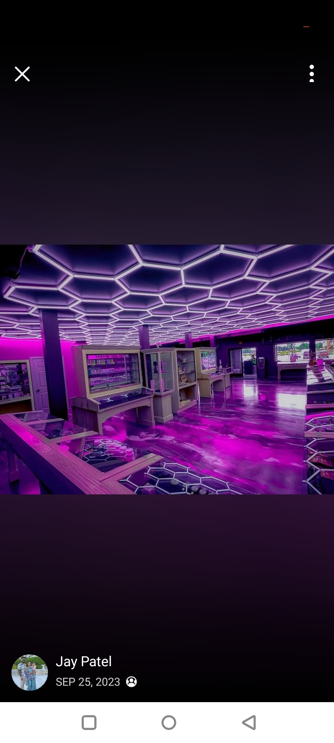 First Place: purple and silver metallic epoxy floor under hexagonal LED ceiling — Jay Patel for JK Precision Cleaning