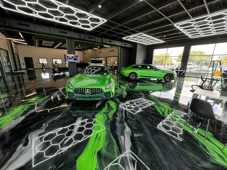 Lime green, black, and white metallic epoxy showroom with Mercedes-AMG vehicles — Victory Epoxy / Kristopher Kršlović